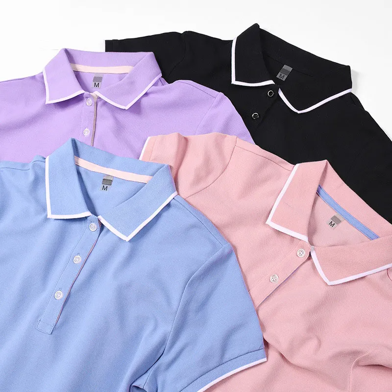 Five polo shirts in different colors arranged on a white background