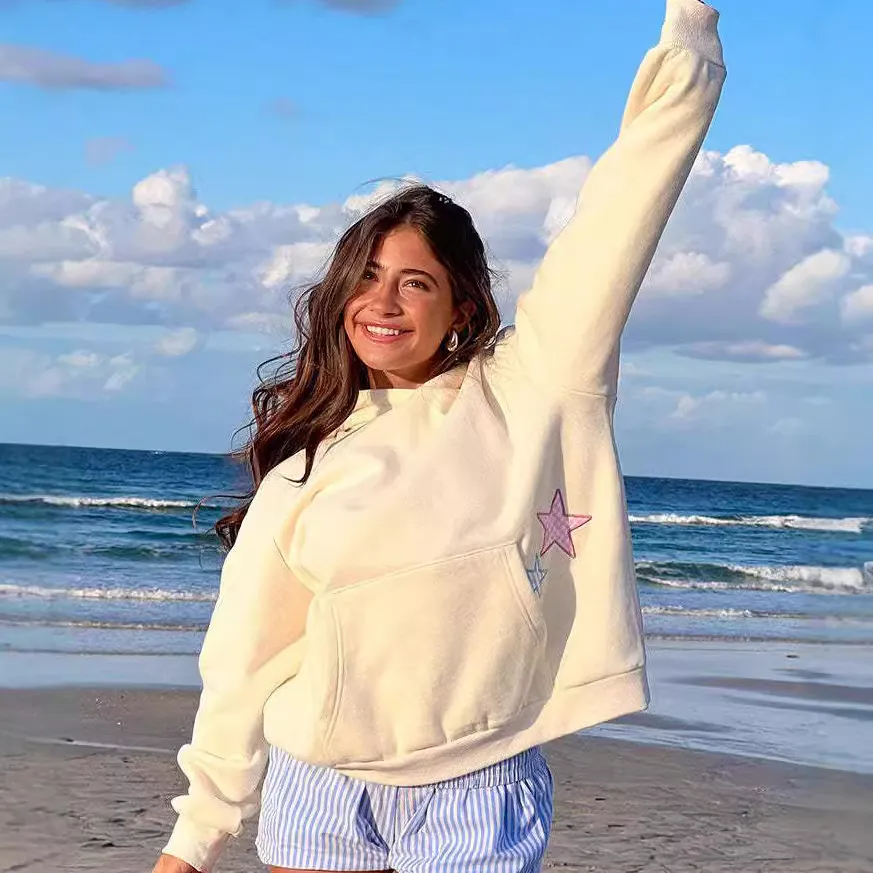 Multypros fashion hoodies with pocket for women in cream color worn by smiling woman on beach