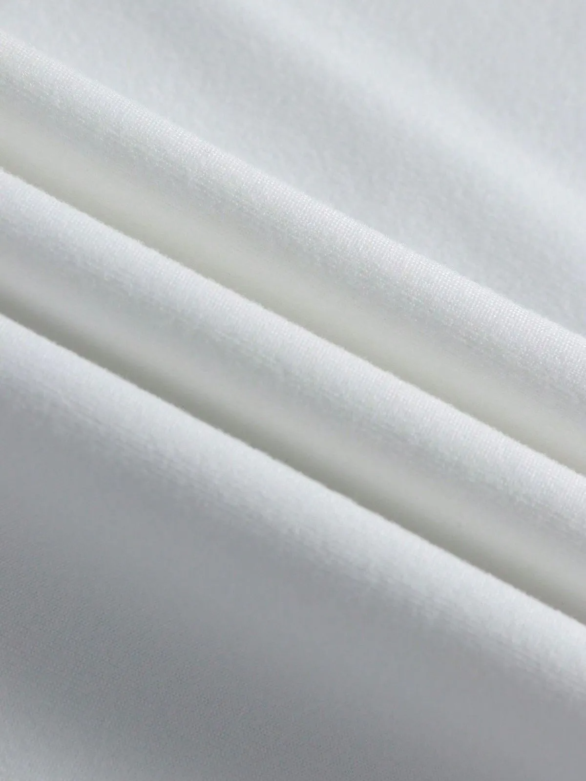 Close-up of soft white fabric texture for a trendy crop top for women by Multypros