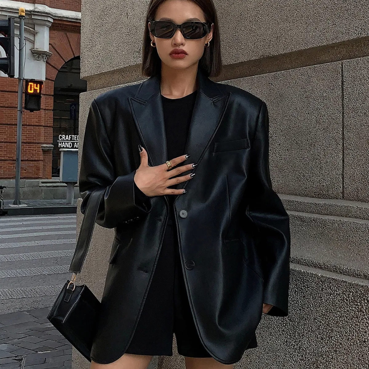 Multypros black casual long sleeve lapel coat worn with sunglasses and black handbag in urban setting