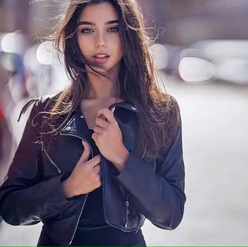 Wholesale moto jacket for women in black leather by Multypros modeled outdoors