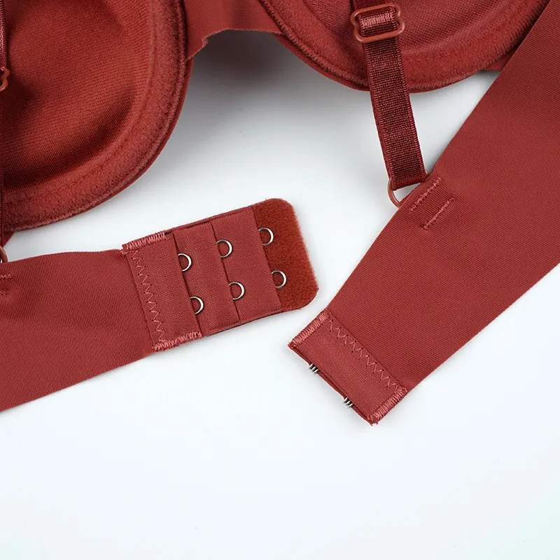 Close-up of rust color women's push-up bra wholesale with adjustable straps and hook closure