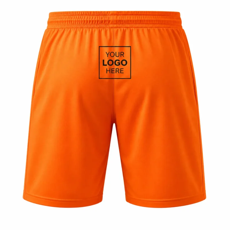 Orange men’s sports shorts with drawstring waist, side pockets and black graphic design.