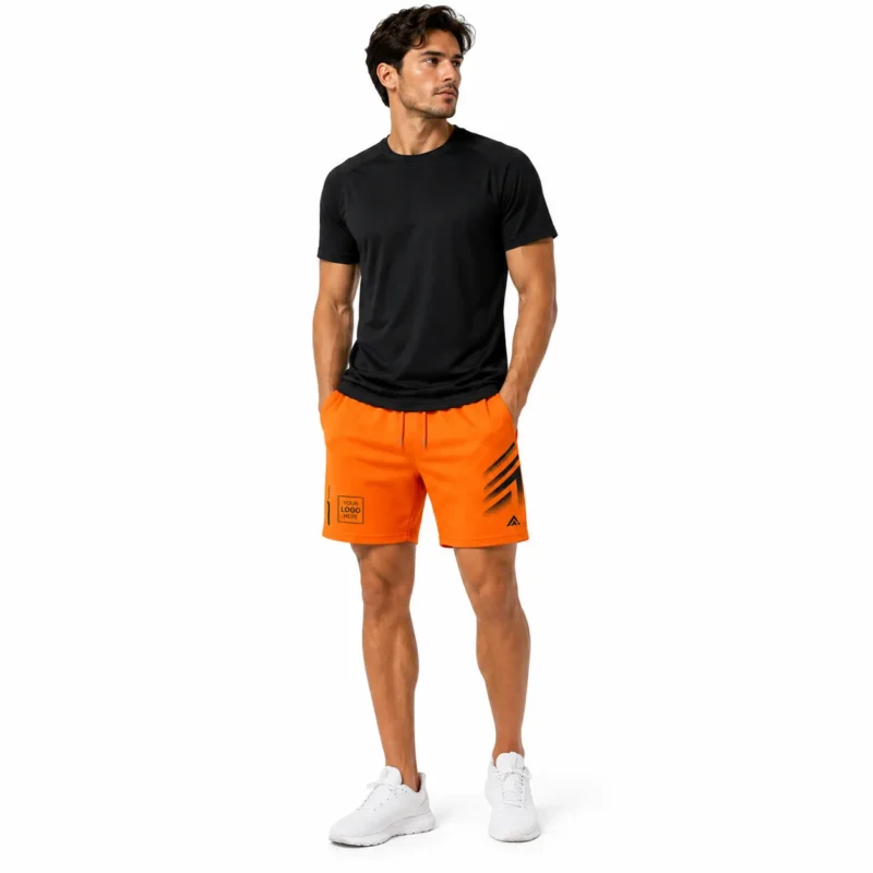 Orange performance sports shorts with elastic waist, drawstring and black graphic print.