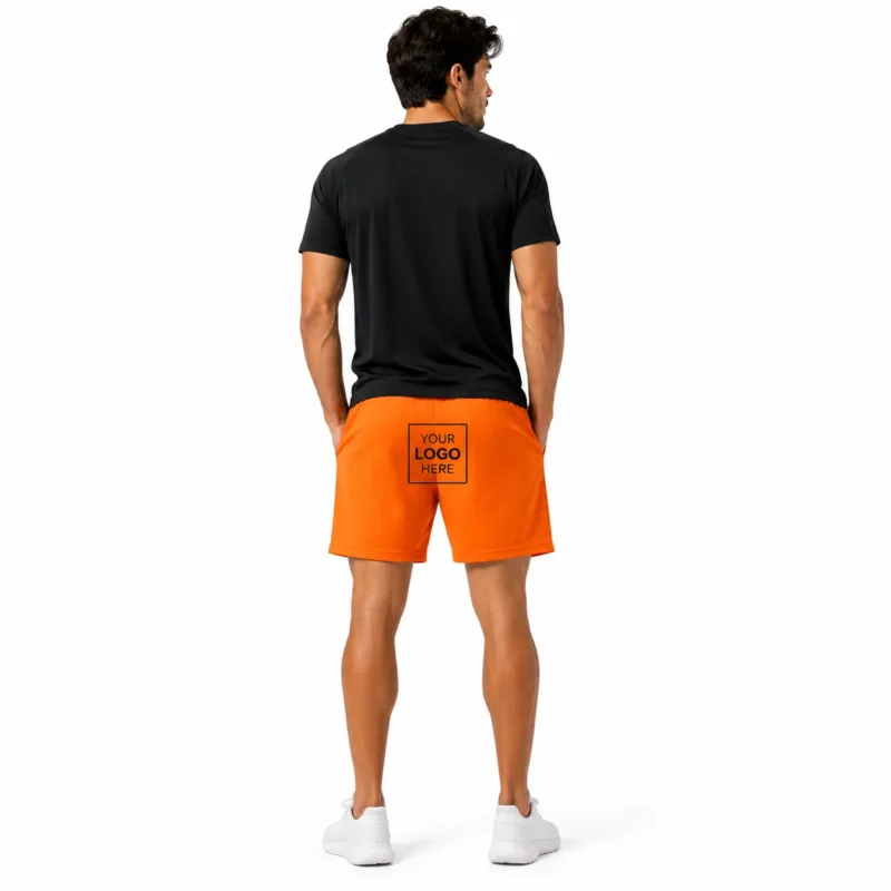 Orange gym shorts with elastic waistband, drawstring, pockets and black athletic graphics.