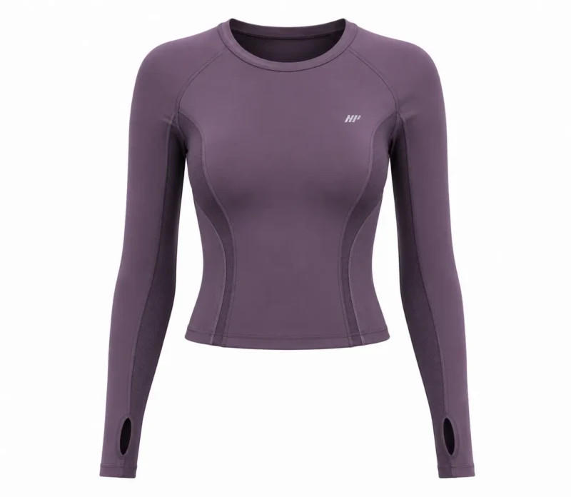Women’s plum purple technical performance top with long sleeves, contoured body panels, breathable mesh side panels, flatlock stitching, crew neck, and thumbhole cuffs