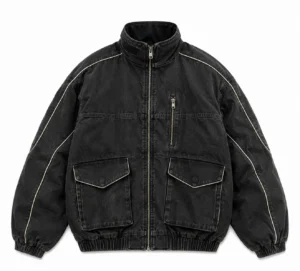 bomber-jacket-vintage-front Vintage bomber jacket in washed black denim featuring a stand collar, full front zipper, large flap pockets, chest zip pocket, contrast piping, elastic cuffs and waistband.