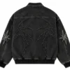 custom-jean-jacket-back Back view of a custom jean jacket in washed black denim, featuring a structured collar, long sleeves, ribbed cuffs and hem, with space for custom embroidery and branding.