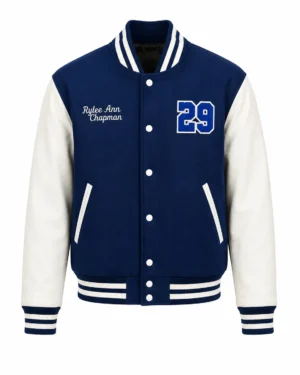 navy-blue-varsity-jacket-front Blue varsity jacket with white leather sleeves, striped ribbed collar and cuffs, snap button closure, embroidered name and number 29 chenille patch on the chest.