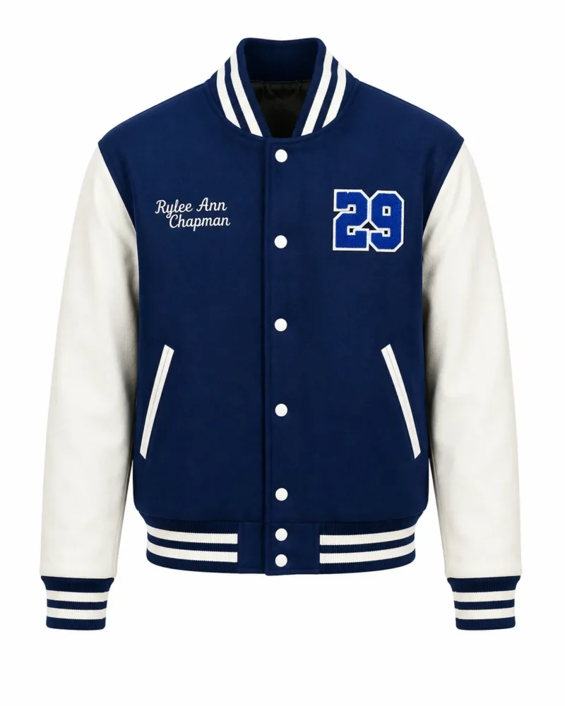 Blue varsity jacket with white leather sleeves, striped ribbed collar and cuffs, snap button closure, embroidered name and number 29 chenille patch on the chest.