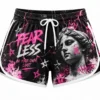custom-athletic-shorts-front Women's custom athletic shorts featuring a black, pink and white graphic design, elastic waistband, white drawstring, contrast side piping and bold artistic artwork.